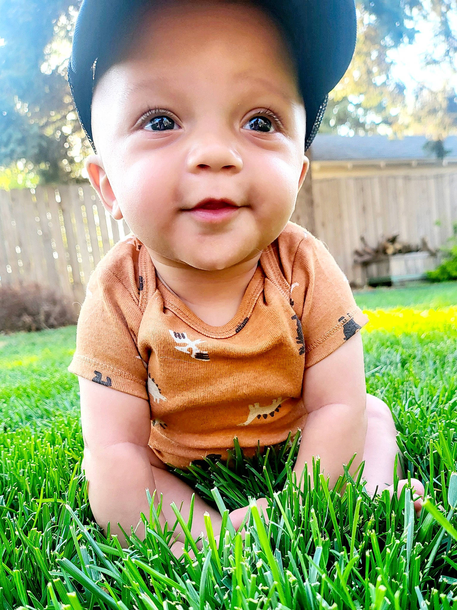 Dobby is registered to the contest to win money with this photo: baby, baby_toddler_clothing, cheek, eye, finger, flash_photography, grass, green, happy, hat, leisure, lip, nose, people_in_nature, person, photograph, plant, skin, sleeve, sunlight