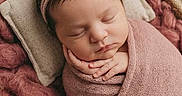 Ember is registered to the contest to win money with this photo: newborn, baby, sleeping, wrapped, blanket, headband, flowers, basket, cozy, soft, peaceful, portrait, infant, cute, resting, decor, pink, warm, hands, closeup