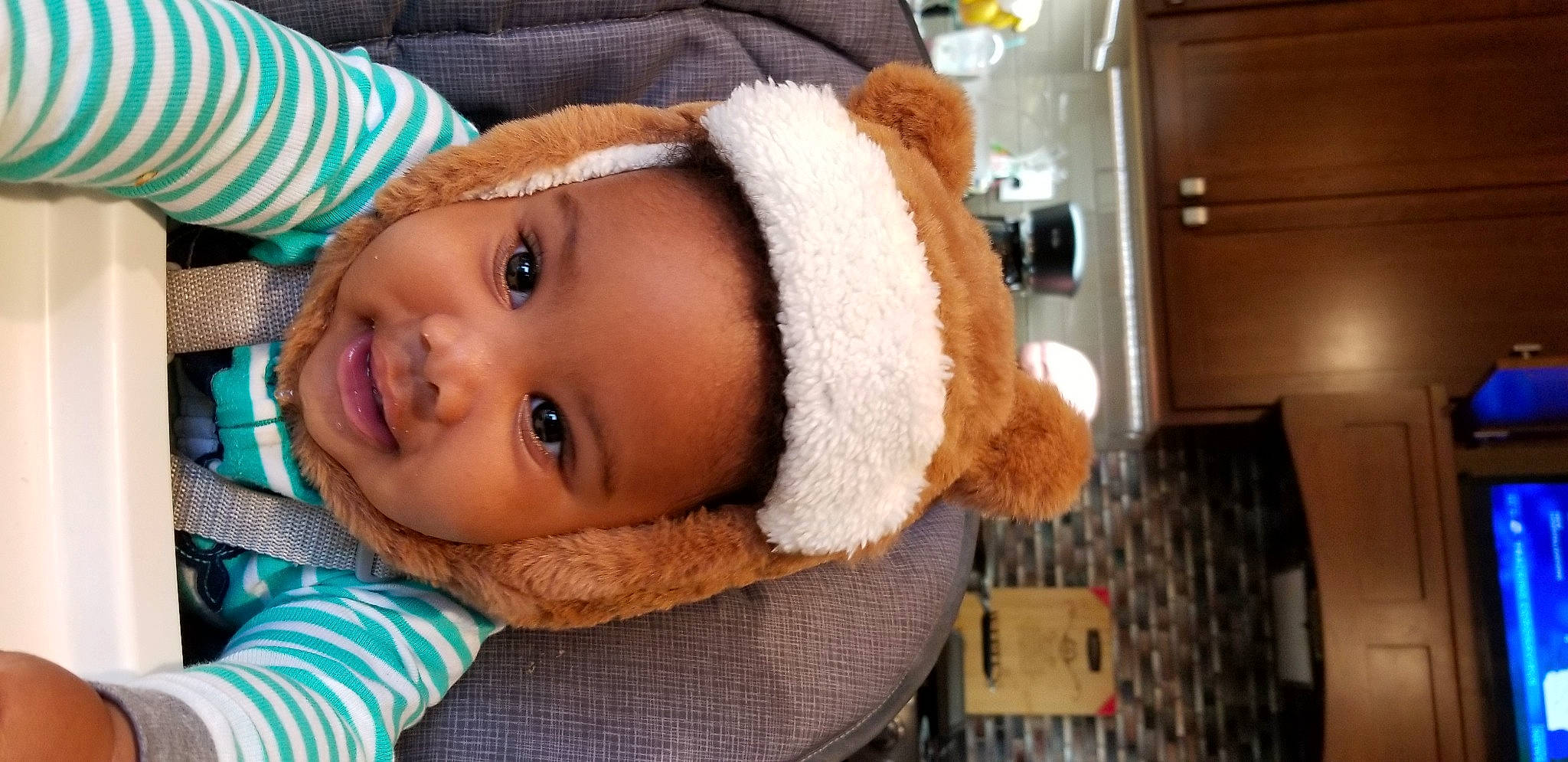 Nehemiah is registered to the contest to win money with this photo: baby, cheek, child, ear, headgear, nose, person, skin, smile, toddler, wool