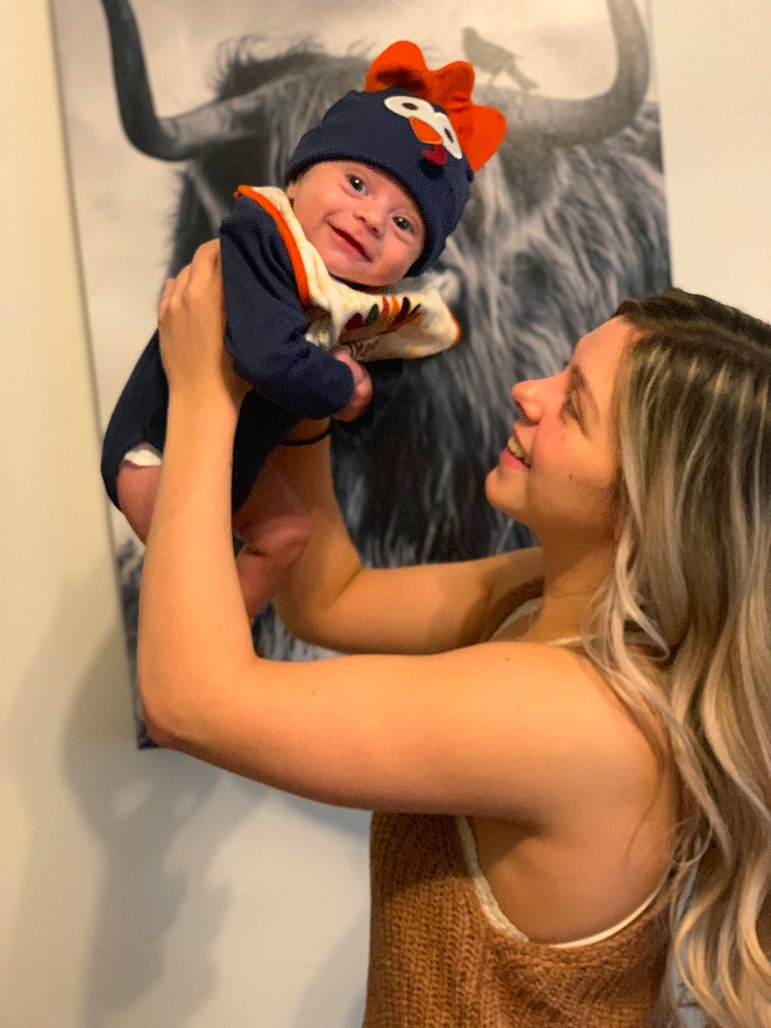 Hank is registered to the contest to win money with this photo: blond, costume, costume_accessory, costume_hat, fun, gesture, hair_accessory, happy, headwear, horn, humour, interaction, joy, love, person, playing_with_kids, trick_or_treat, witch_hat