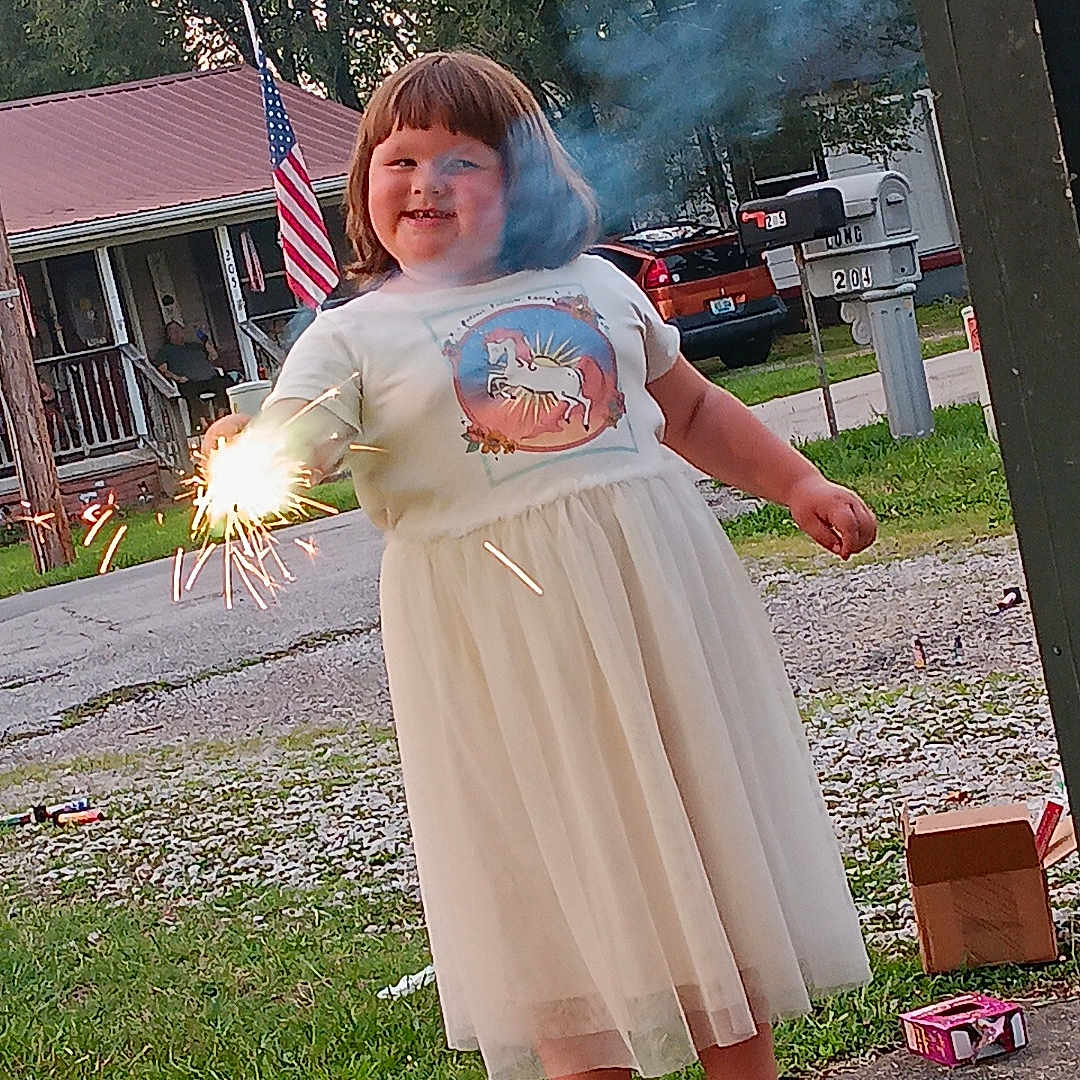 Ava joined the competition — help win amazing prizes! car, child, clothing, costume, dress, face, female, footwear, girl, grass, head, outdoors, person, photography, plant, portrait, sandal, smoke, transportation, vehicle