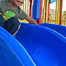 Dj joined the competition — help win amazing prizes! child, playground, slide, outdoor, smiling, portrait, play, play_equipment, blue_slide, colorful, rails, tunnel, curly_hair, t_shirt, pants, sneakers, daylight, summer, happy, photograph