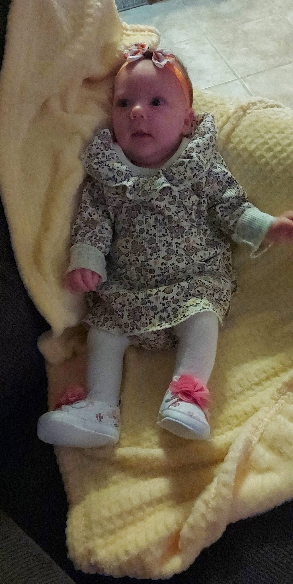 Reya is registered to the contest to win money with this photo: baby, baby_toddler_clothing, cheek, child, comfort, face, foot, fun, human_leg, leg, magenta, nose, organ, person, pink, sitting, skin, sleeve, sock, toddler