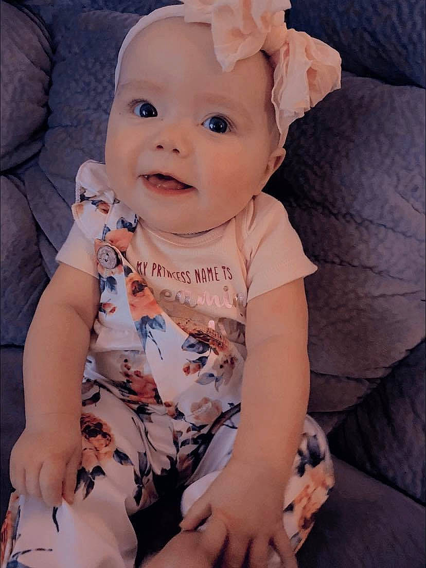 Aston is registered to the contest to win money with this photo: baby, baby_toddler_clothing, cheek, comfort, cool, eye, face, finger, happy, head, headwear, human, iris, lip, mammal, person, pink, skin, sleeve, smile