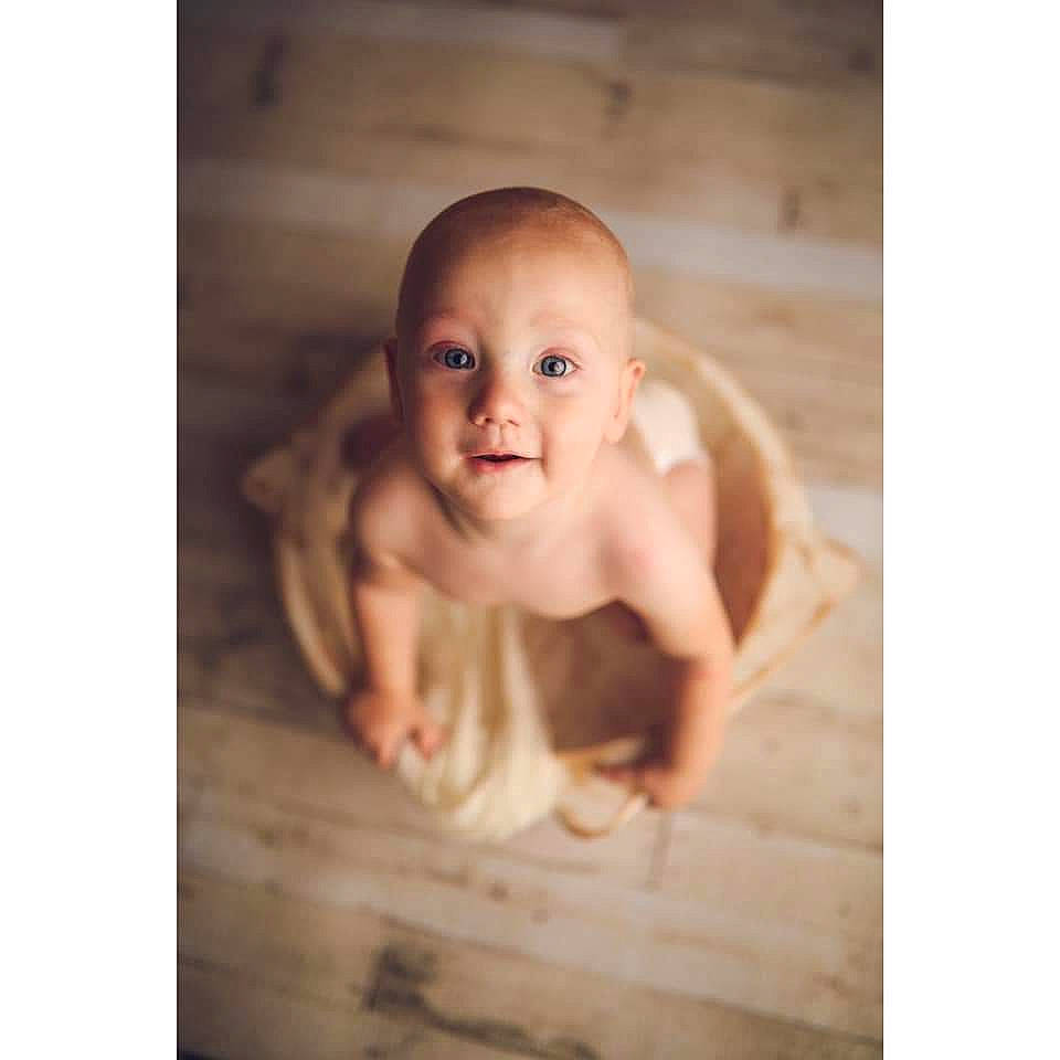 Ezrah  is registered to the contest to win money with this photo: baby, bathing, child, face, hand, person, photograph, photography, portrait, smile, snapshot, stock_photography, toddler