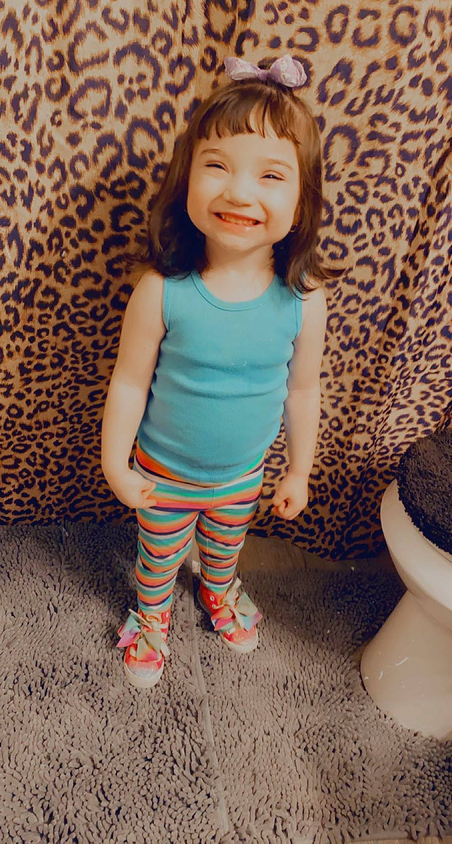 Joslynn is registered to the contest to win money with this photo: arm, baby, baby_toddler_clothing, cheek, dress, eye, floor, happy, head, joy, knee, leg, neck, pattern, person, skin, sleeve, smile, t_shirt, thigh