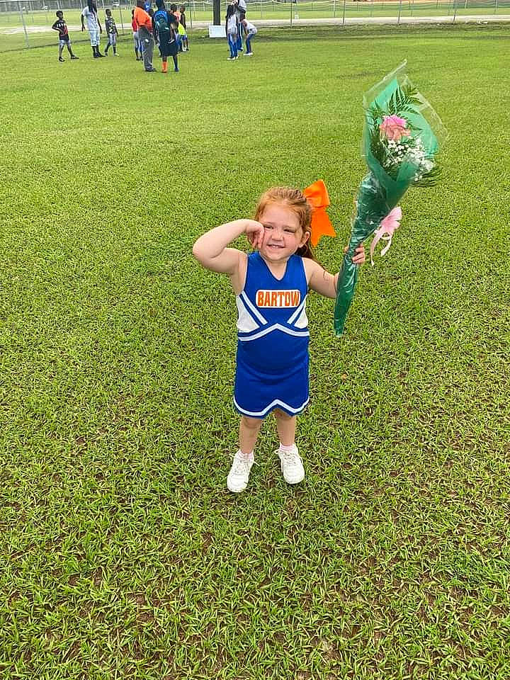 Rebecca joined the competition — help win amazing prizes! ball_game, cheerleading_uniform, competition_event, football_player, fun, grass, grass_family, grassland, happy, joy, lawn, meadow, people_in_nature, person, player, recreation, smile, sports, team, team_sport