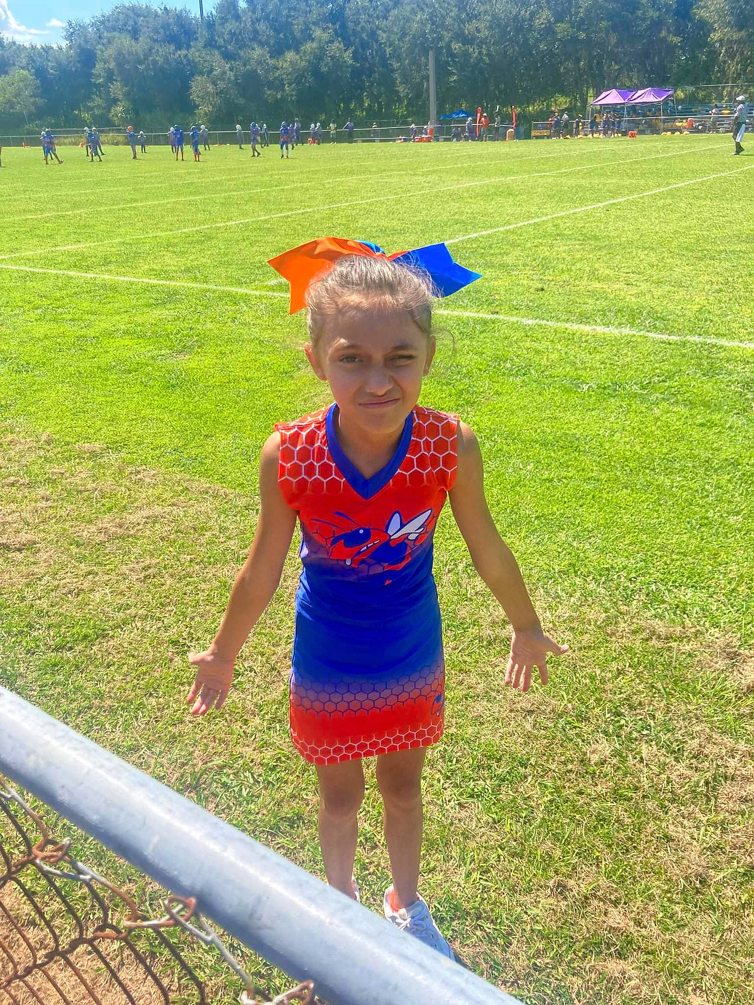 Danielle is registered to the contest to win money with this photo: baby_toddler_clothing, child, electric_blue, fun, grass, grass_family, grassland, happy, joy, landscape, leisure, meadow, party_supply, people_in_nature, person, plant, play, prairie, recreation, summer