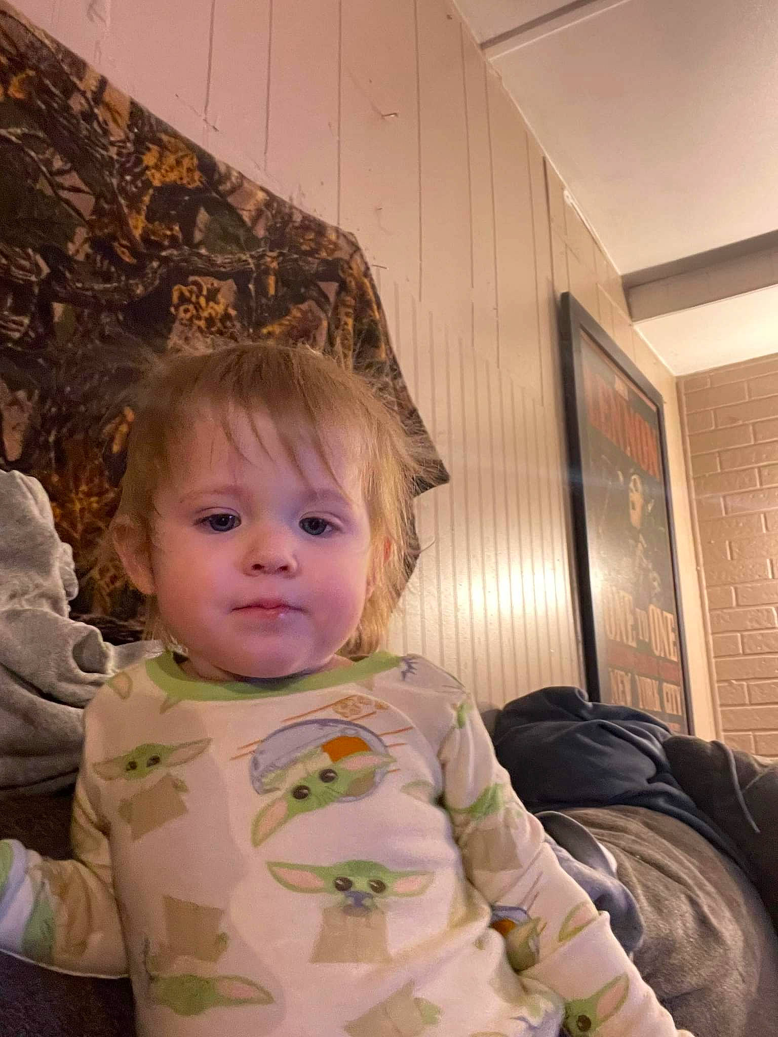 Astridr is registered to the contest to win money with this photo: baby, baby_toddler_clothing, backpack, cheek, child, comfort, facial_expression, flooring, fun, hairstyle, happy, head, iris, person, room, sitting, standing, textile, toddler, window_blind