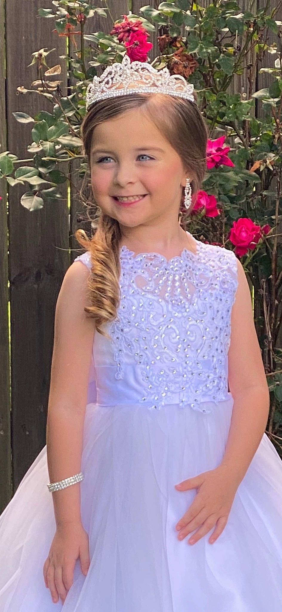 Ella is registered to the contest to win money with this photo: bridal_clothing, bridal_party_dress, day_dress, dress, embellishment, eye, face, fashion, gown, hairstyle, happy, head, iris, joy, neck, person, pink, plant, shoulder, smile