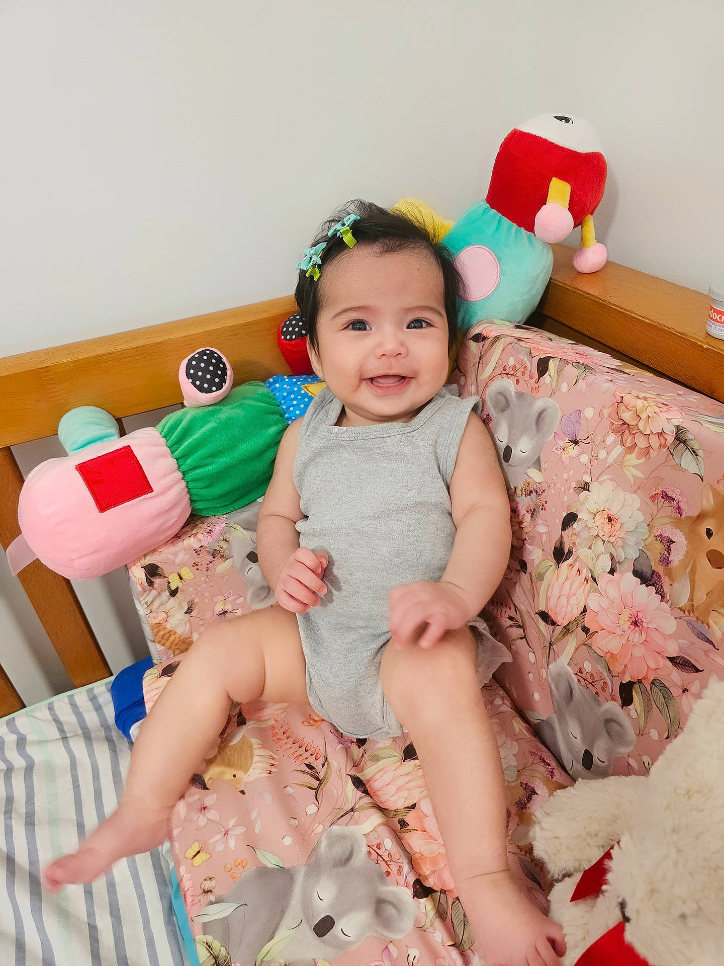 Serenity Rose is registered to the contest to win money with this photo: baby, baby_playing_with_toys, baby_toddler_clothing, child, comfort, foot, fun, happy, human_leg, joy, lap, leg, person, pink, room, skin, smile, sock, stuffed_toy, thigh