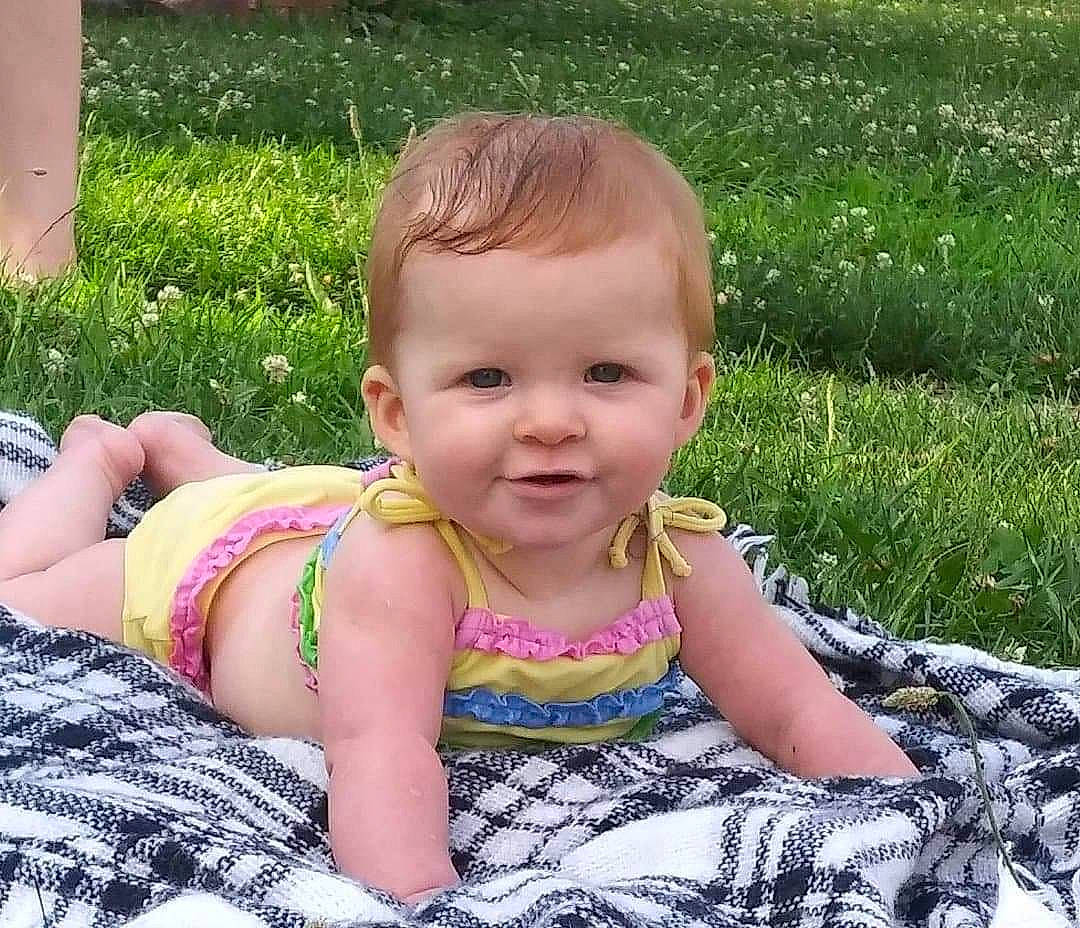 Jordyn joined the competition — help win amazing prizes! baby, baby_toddler_clothing, cheek, child, facial_expression, fun, grass, grass_family, happy, joy, lawn, leisure, pattern, people, people_in_nature, person, photograph, plant, sitting, smile