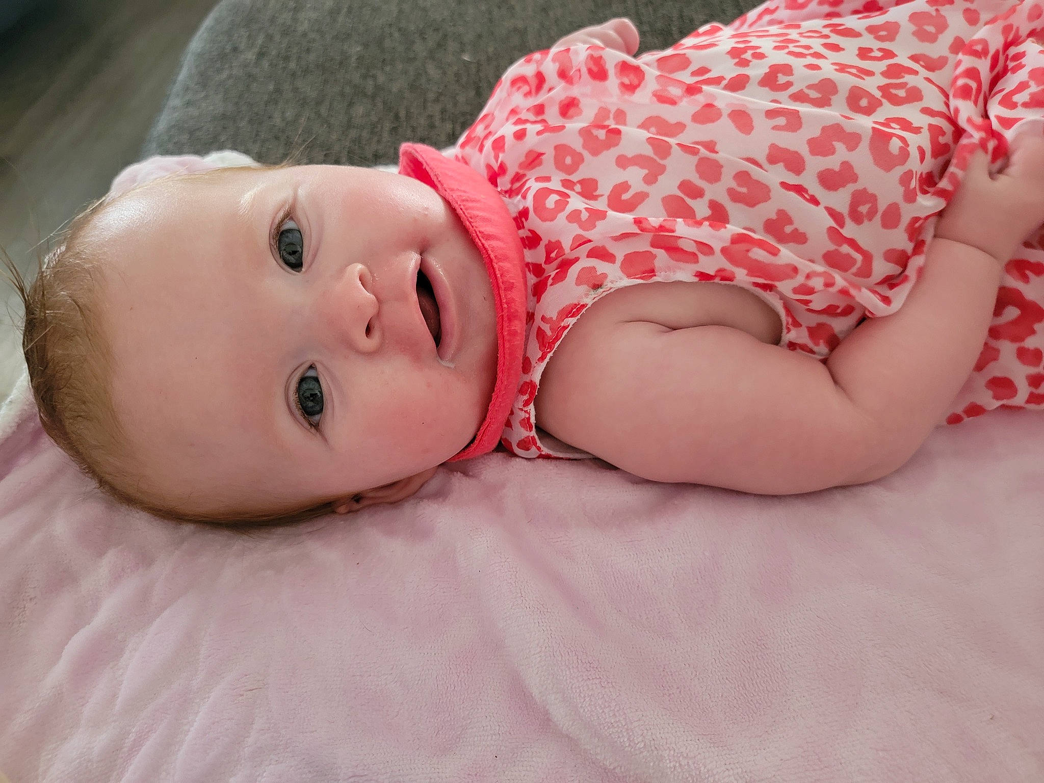 Jordyn joined the competition — help win amazing prizes! baby, baby_toddler_clothing, cheek, child, comfort, eye, flash_photography, grass, hand, happy, human_body, iris, lip, pattern, person, pink, skin, sleeve, smile, toddler