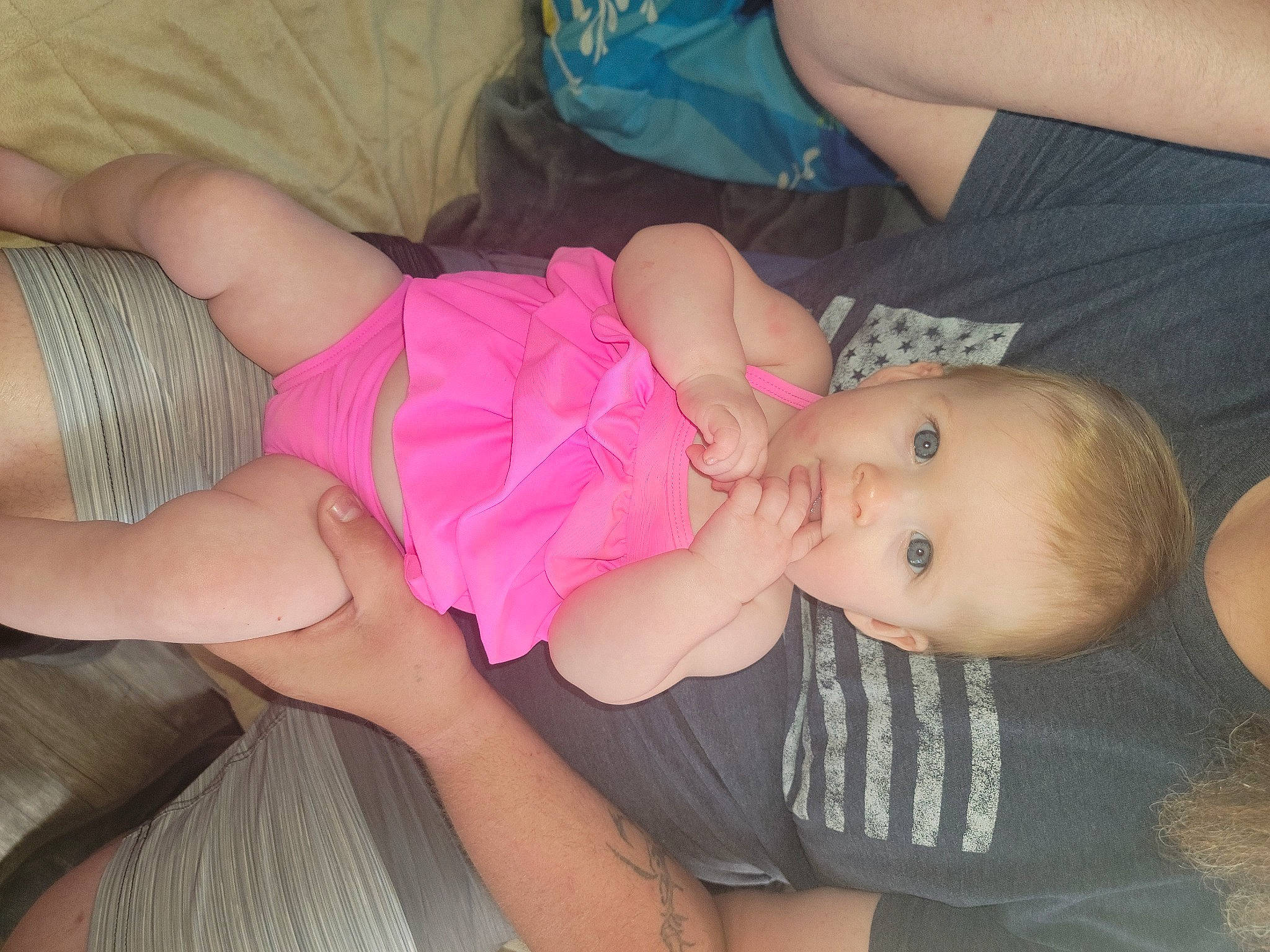 Jordyn is registered to the contest to win money with this photo: arm, baby, baby_toddler_clothing, cheek, comfort, finger, head, human_body, joint, leg, mouth, muscle, nail, organ, person, pink, skin, thigh, thumb, toddler