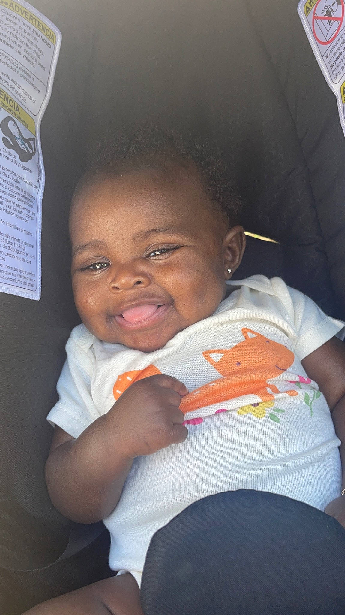 Joie Marie is registered to the contest to win money with this photo: arm, baby, cheek, child, comfort, eyebrow, finger, forehead, fun, gesture, happy, joy, lip, mouth, nose, person, room, sitting, skin, smile