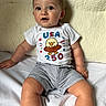 Lenny joined the competition — help win amazing prizes! baby, child, infant, sitting, white_shirt, usa, eagle, cartoon, shorts, striped_shorts, curious, portrait, indoors, soft_background, cute, smiling, face, person, young, casual_clothing