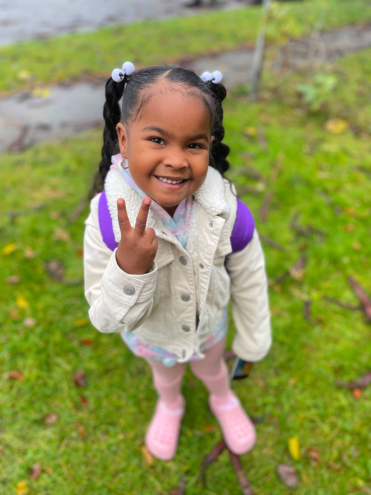 Aaminah is registered to the contest to win money with this photo: audio_equipment, barefoot, child, field, fun, grass, grass_family, grassland, hair_tie, happy, joy, leisure, meadow, people_in_nature, person, plant, portrait_photography, recreation, sitting, smile