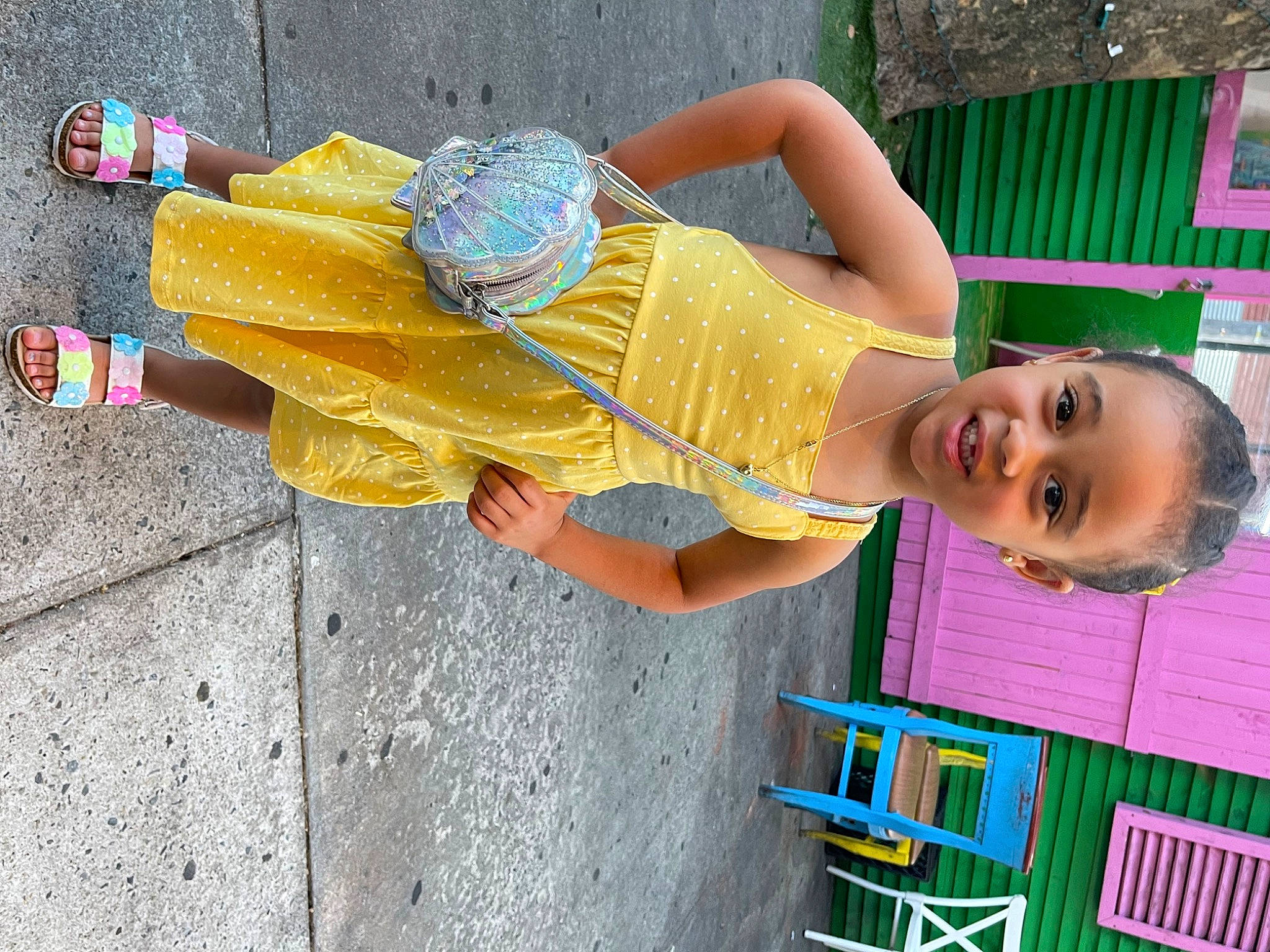 Allison is registered to the contest to win money with this photo: asphalt, child, electric_blue, fun, happy, hat, human_leg, leisure, magenta, person, road, sandal, sidewalk, smile, street, street_fashion, summer, thigh, toddler, vacation