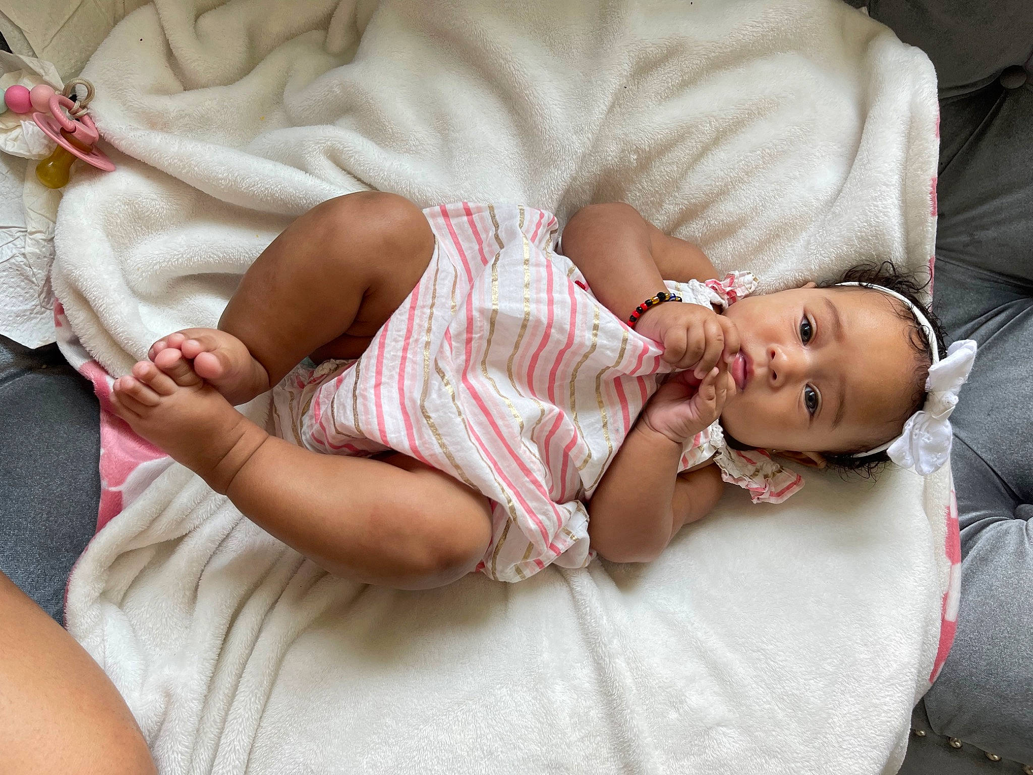 Arlene joined the competition — help win amazing prizes! arm, baby, baby_toddler_clothing, cheek, comfort, couch, eye, finger, glasses, hand, head, headgear, human_body, leg, lip, person, pink, skin, textile, thigh