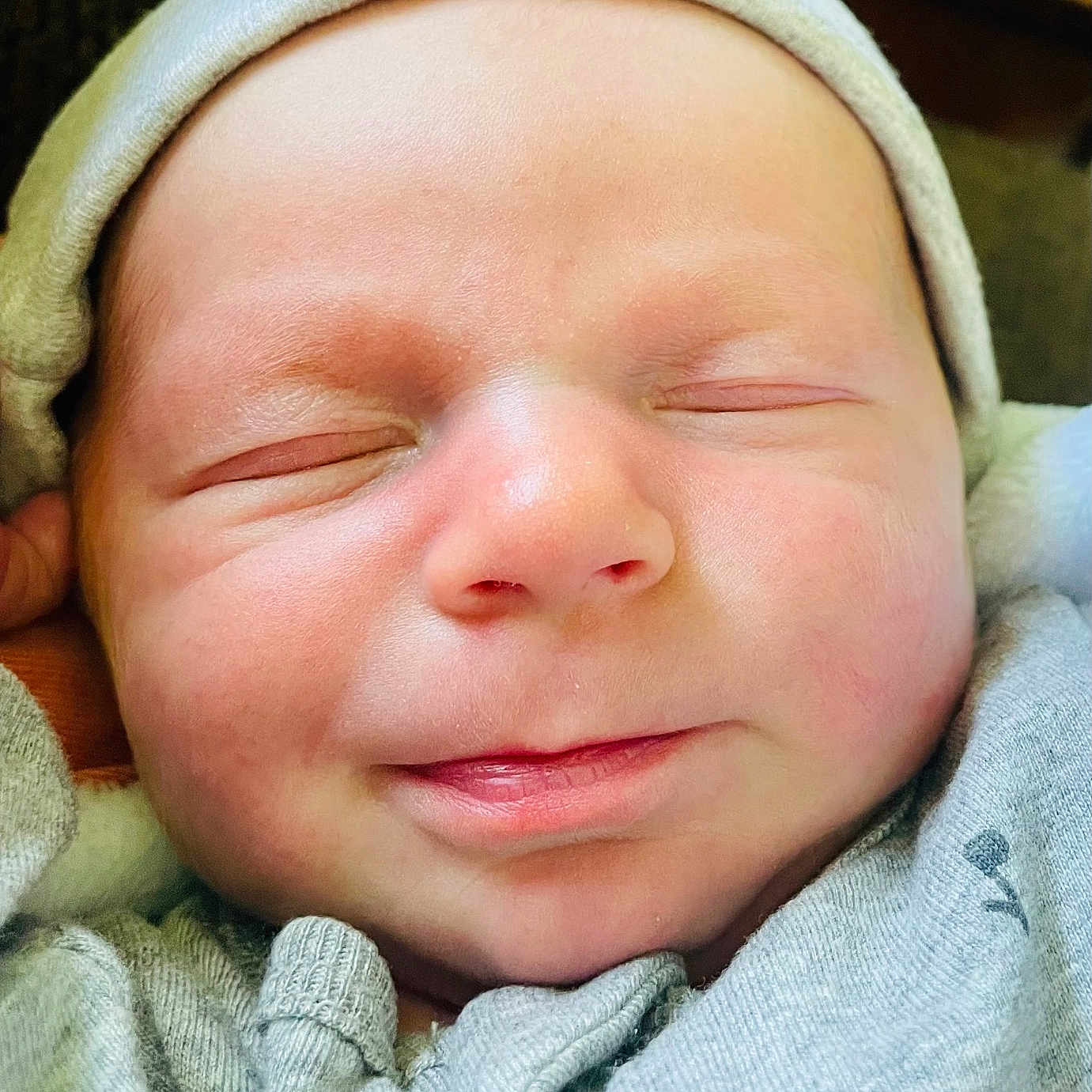 Brayden is registered to the contest to win money with this photo: baby, blanket, bonnet, cap, clothing, coat, face, glove, happy, hat, head, hood, hoodie, jacket, newborn, person, photography, portrait, sleeping, smile