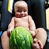 baby, child, infant, watermelon, fruit, smiling, sitting, barefoot, portrait, indoors, chair, close_up, face, eyes, hands, feet, skin, happy, funny, photography