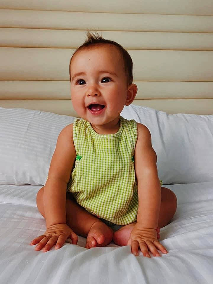Carter joined the competition — help win amazing prizes! baby, baby_products, baby_toddler_clothing, cheek, child, child_model, dress, face, finger, head, joy, leg, pattern, person, photography, product, sitting, skin, sleeve, smile