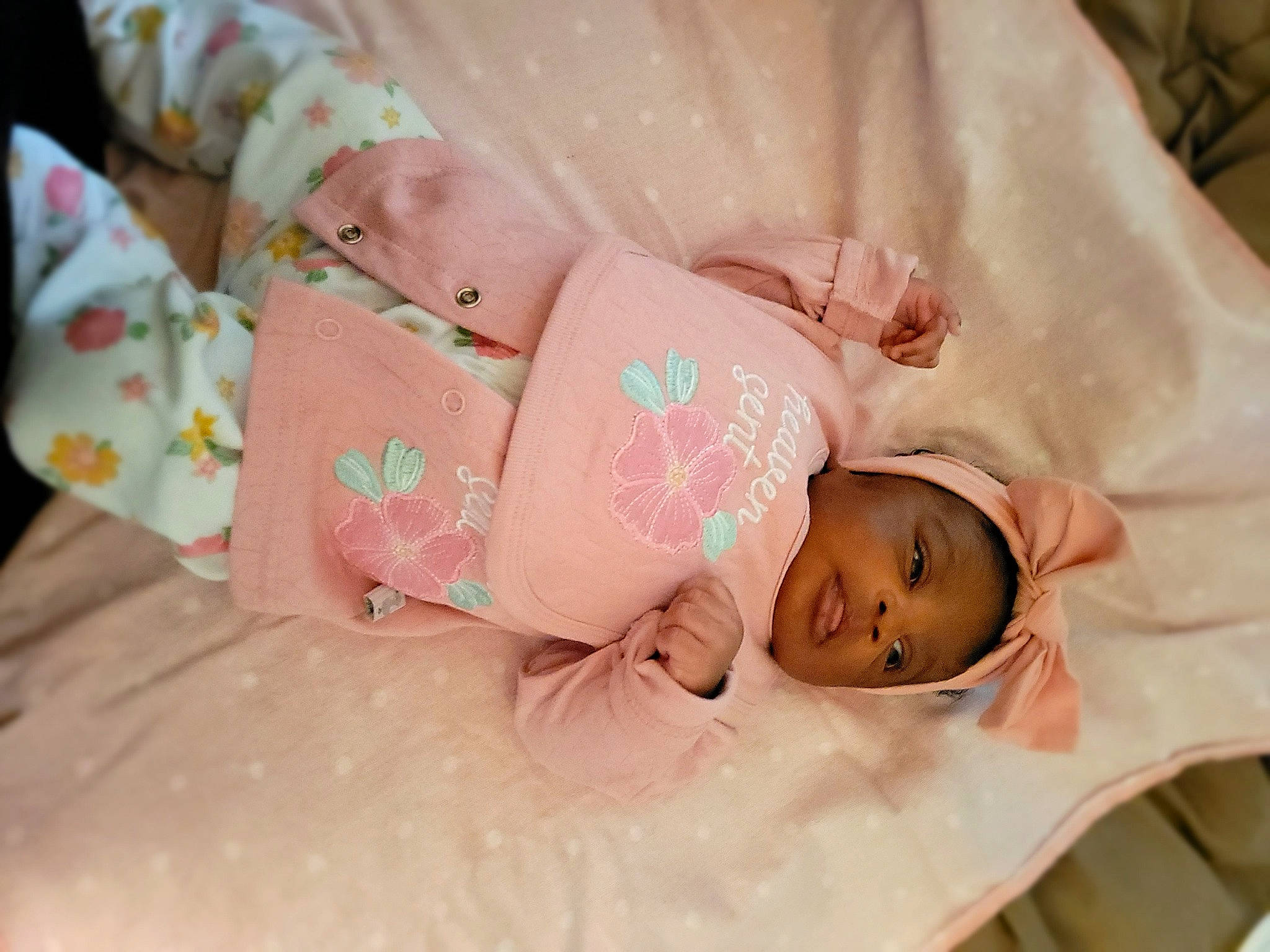 Miracle is registered to the contest to win money with this photo: arm, baby, baby_products, baby_toddler_clothing, child, comfort, event, fashion_accessory, hair_accessory, happy, headpiece, hospital, human_body, jewellery, linens, pattern, peach, person, room, skin