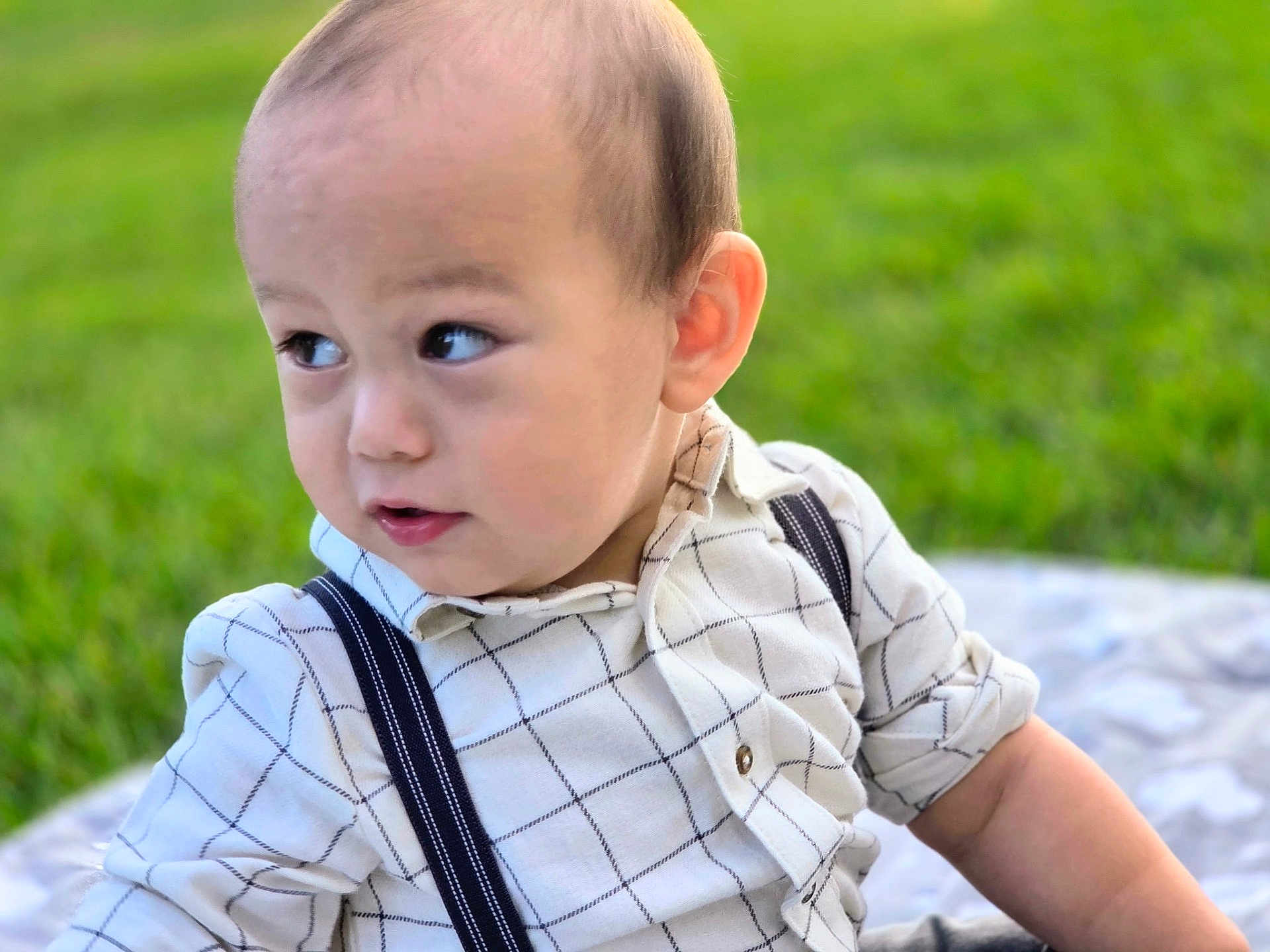 Nicholas joined the competition — help win amazing prizes! toddler, child, baby, outdoor, grass, blanket, shirt, suspenders, portrait, cute, young, person, face, head, expression, curious, sitting, nature, daylight, casual