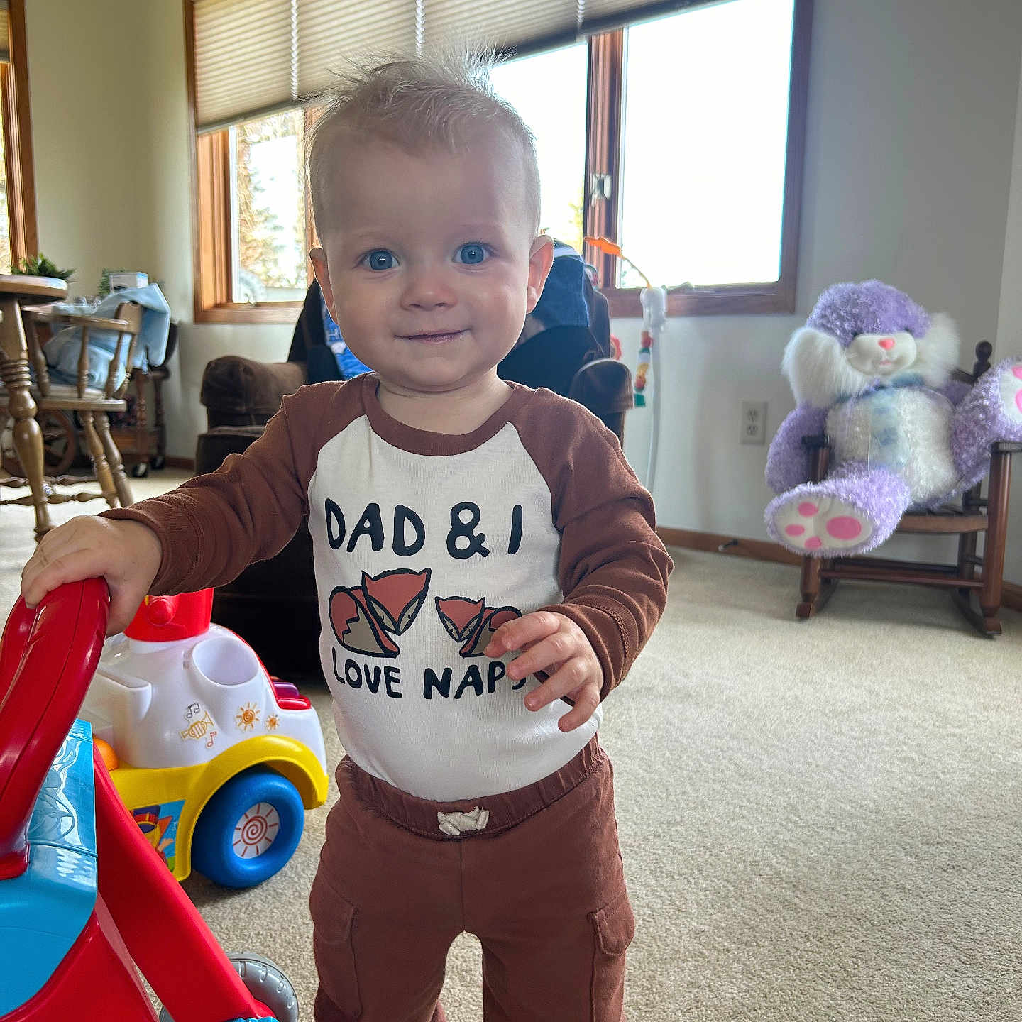 Asher is registered to the contest to win money with this photo: architecture, boy, building, chair, child, clothing, couch, face, furniture, head, indoors, livingroom, male, pants, person, photography, portrait, room, t_shirt, toy