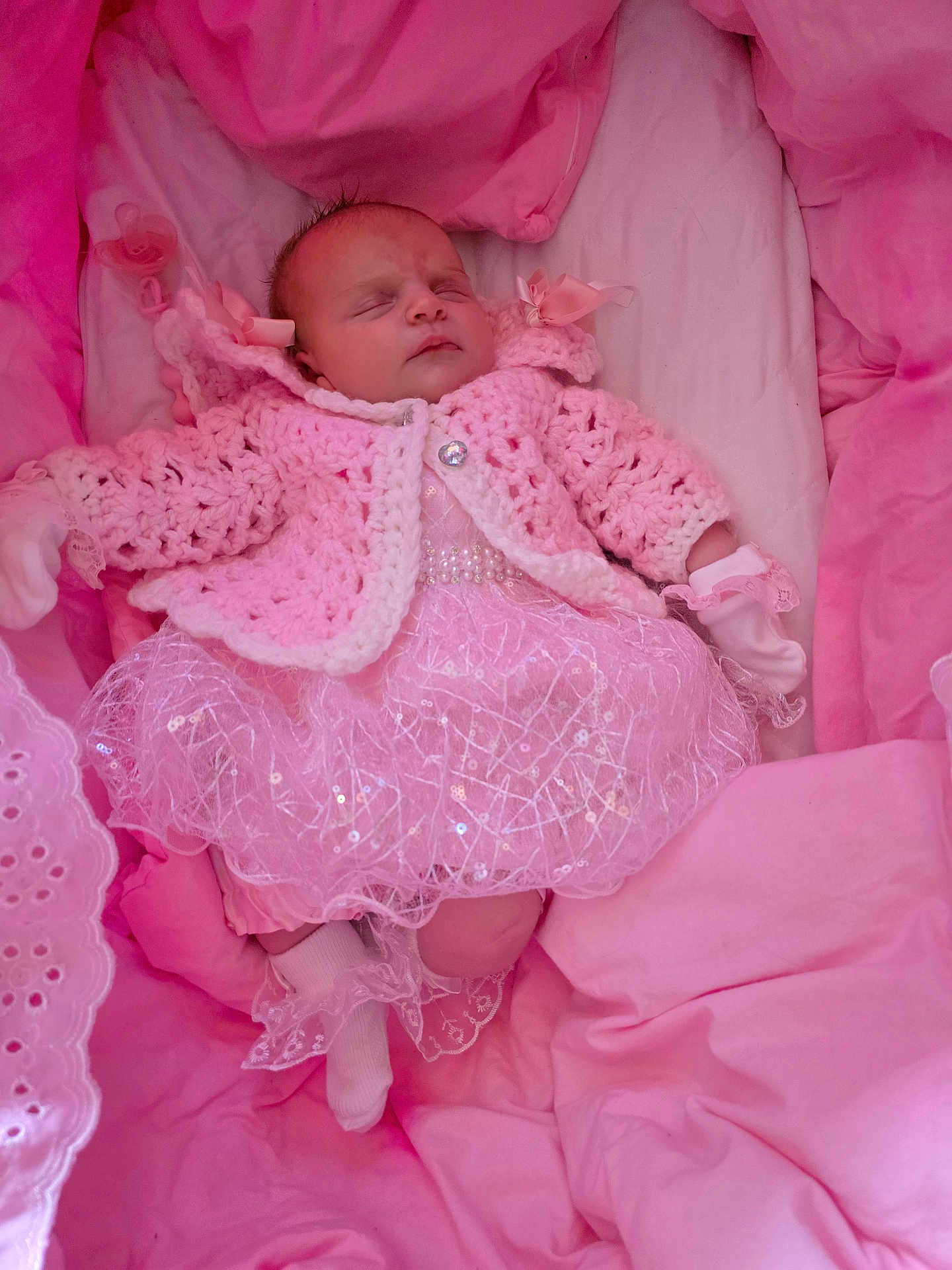 Kalilah-Rose joined the competition — help win amazing prizes! baby, sleeping, pink_clothing, crocheted_sweater, lace_dress, soft_blankets, cushions, newborn, infant, cozy, indoor, cute, child, warm, resting, glitter, decorative, peaceful, portrait, small