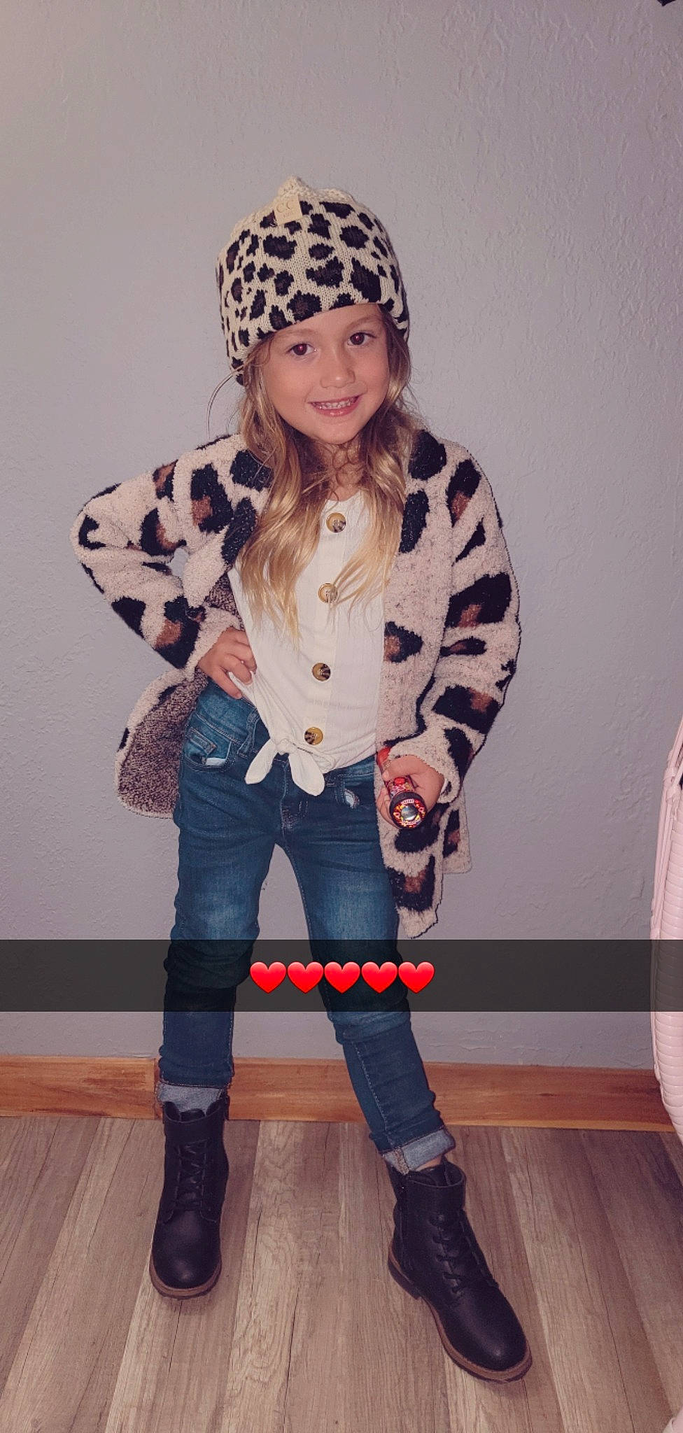 Harlee is registered to the contest to win money with this photo: cap, clothing, eyewear, face, fashion, fashion_design, footwear, fur_clothing, headgear, headwear, joy, knee, knee_high_boot, outerwear, person, shoe, sleeve, street_fashion, t_shirt, textile