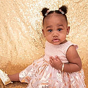 Amoura-Reign is registered to the contest to win money with this photo: toddler, child, girl, portrait, dress, flower_clips, hairstyle, bracelet, earrings, golden_shoes, sparkling_background, sitting, curious_expression, indoor, cute, fashion, young_child, studio_photo, face, person