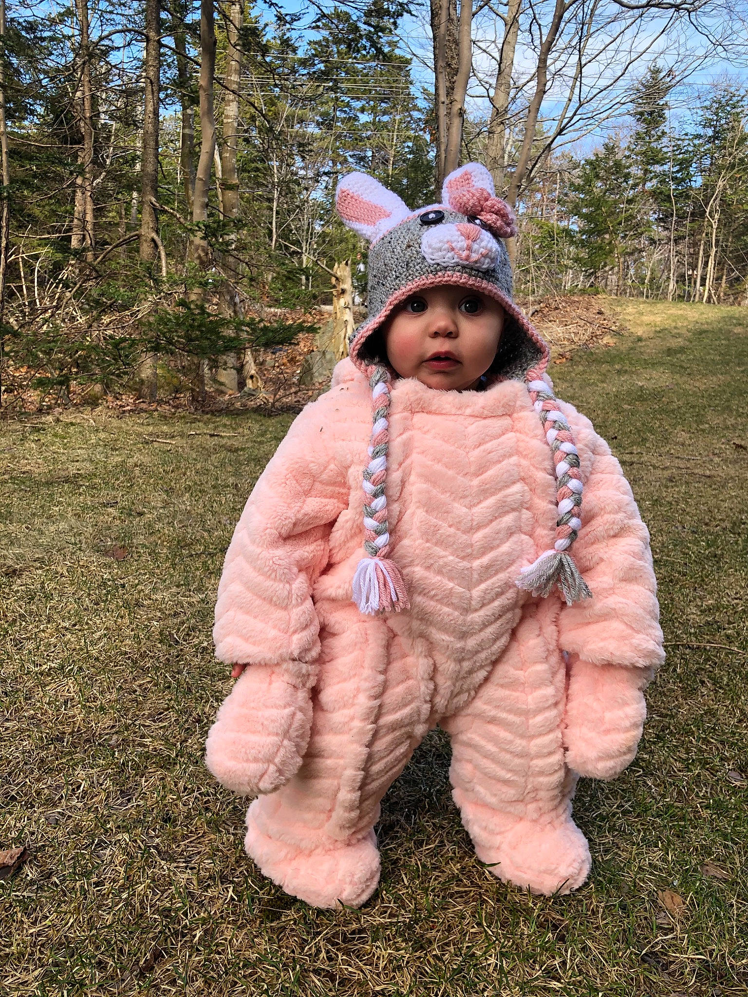 Rhea is registered to the contest to win money with this photo: costume, ear, fawn, fun, fur, grass, headgear, headwear, outerwear, person, pink, plant, tree, winter