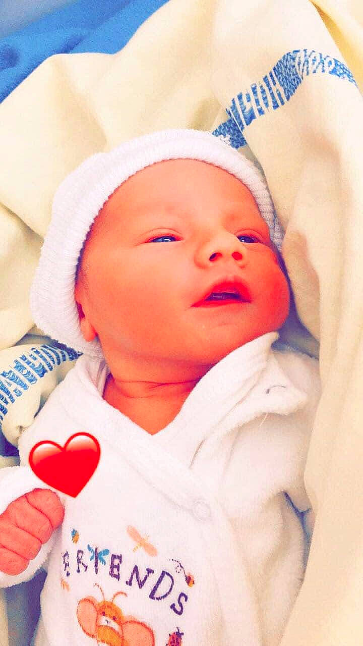 Lindo participe au concours pour gagner de l'argent avec cette photo : baby, baby_sleeping, baby_toddler_clothing, blue, cheek, chin, comfort, eyebrow, finger, happy, headwear, lip, mouth, nose, person, pink, product, skin, smile, textile