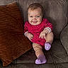 Rubyann joined the competition — help win amazing prizes! baby, child, infant, smiling, tongue_out, sitting, couch, cushion, portrait, indoor, home, floral_outfit, purple_socks, clothing, face, hands, legs, happy, cozy, photography