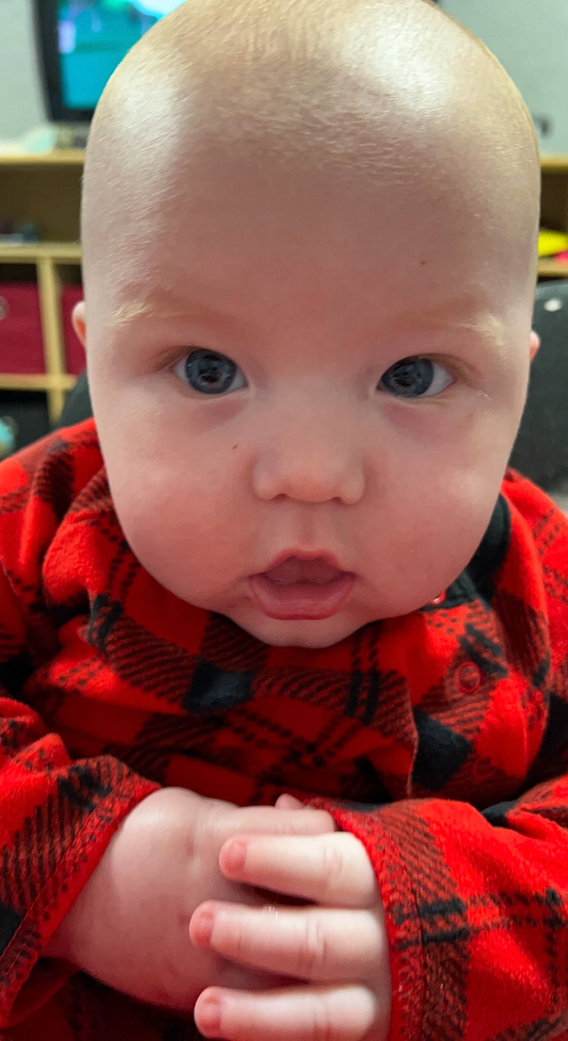 Walker joined the competition — help win amazing prizes! baby, baby_toddler_clothing, cheek, child, close_up, eyelash, finger, gesture, lip, mouth, nail, nose, pattern, person, pink, plaid, shelf, skin, sleeve, tartan