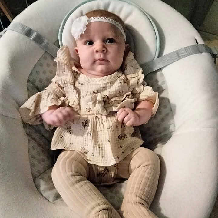 Riley joined the competition — help win amazing prizes! accessories, baby, cap, chair, clothing, costume, couch, cushion, face, furniture, hat, head, homedecor, pajamas, pants, person, photography, portrait, sitting, toy
