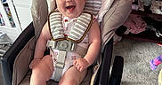 Emily joined the competition — help win amazing prizes! baby, smiling, baby_rocker, infant, nursery, toys, plush_toy, carpet, crib, clothing, child, happy, indoor, seat, person, furniture, baby_clothes, playroom, infant_seat, cute