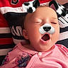 Emily is registered to the contest to win money with this photo: baby, child, sleeping, yawning, dog_filter, face_filter, pink_clothing, onesie, adult, hoodie, red_clothing, person, portrait, cute, cozy, indoor, closeup, human, expression, digital_filter