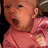 Emily is registered to the contest to win money with this photo: baby, infant, pink_clothing, cute, face, fist, expression, portrait, child, small_hands, newborn, skin, indoor, person, apparel, mouth_open, eyes, head, young, human