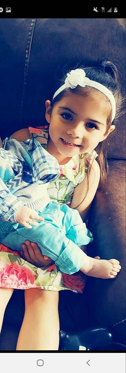 Clarissa Lynn is registered to the contest to win money with this photo: baby_toddler_clothing, blue, child, cool, dress, eye, facial_expression, flash_photography, hair, hairstyle, happy, human, iris, joy, lip, organ, person, pink, skin, smile