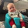 Ted joined the competition — help win amazing prizes! baby, child, infant, blue_baby_seat, red_pants, bib, smile, face, hand, sock, couch, blanket, fabric, indoor, furniture, cute, comfort, portrait, sitting, home