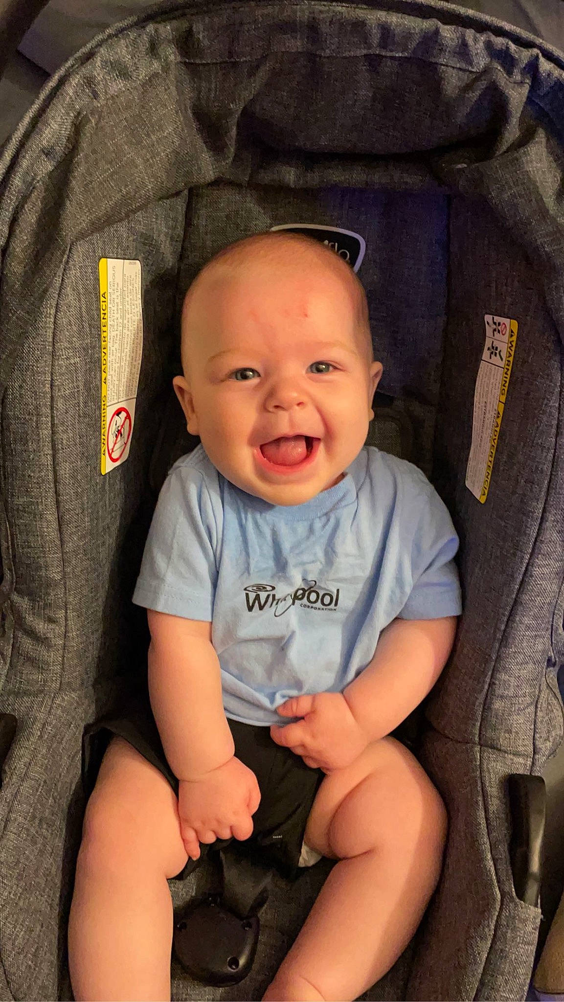 Finnley is registered to the contest to win money with this photo: baby, baby_toddler_clothing, black, cheek, comfort, cool, facial_expression, finger, flash_photography, human, mouth, organ, people, person, product, skin, sleeve, smile, standing, t_shirt