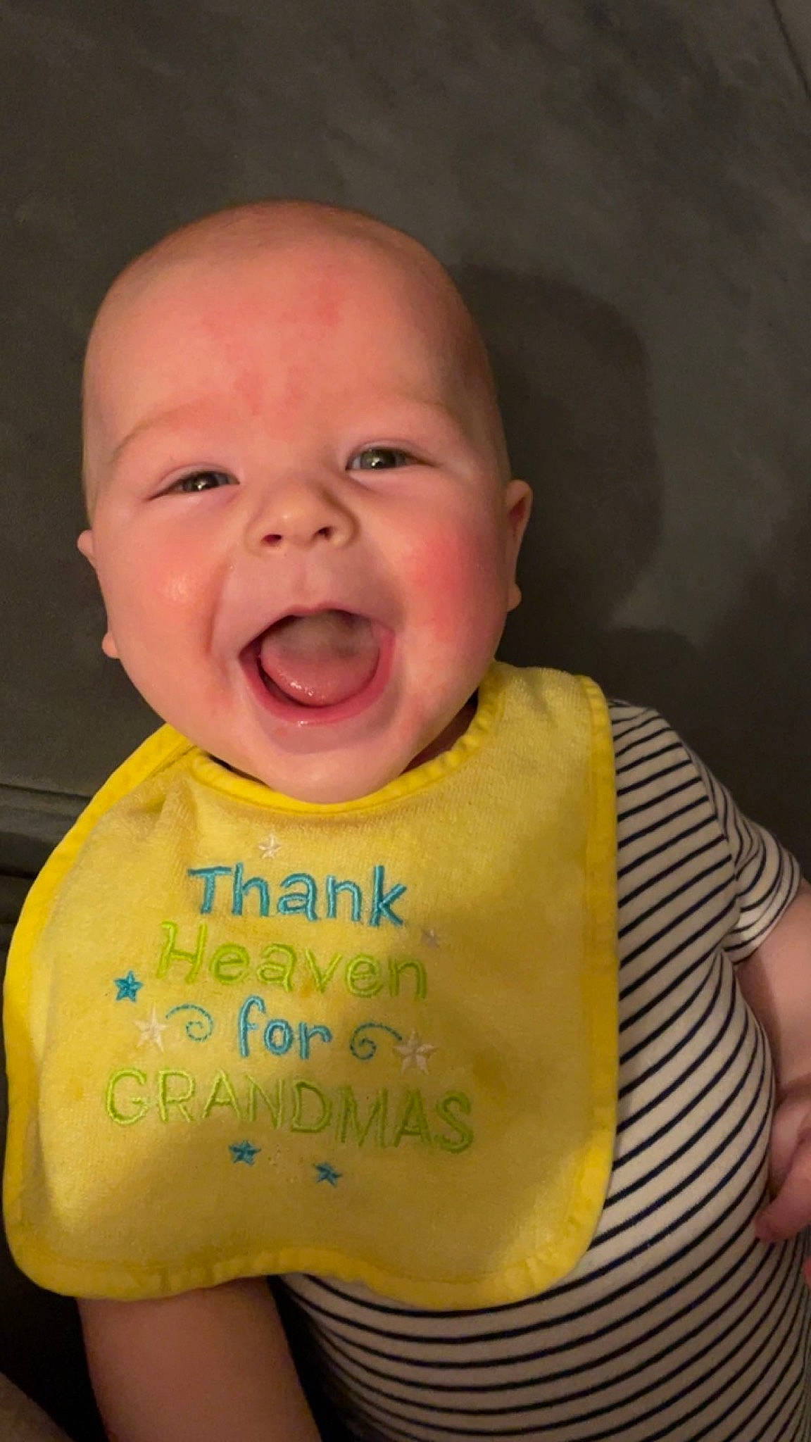 Finnley is registered to the contest to win money with this photo: baby, baby_laughing, baby_toddler_clothing, bib, cheek, crying, eye, eyebrow, forehead, fun, happy, iris, lip, mouth, nose, person, skin, sleeve, smile, t_shirt