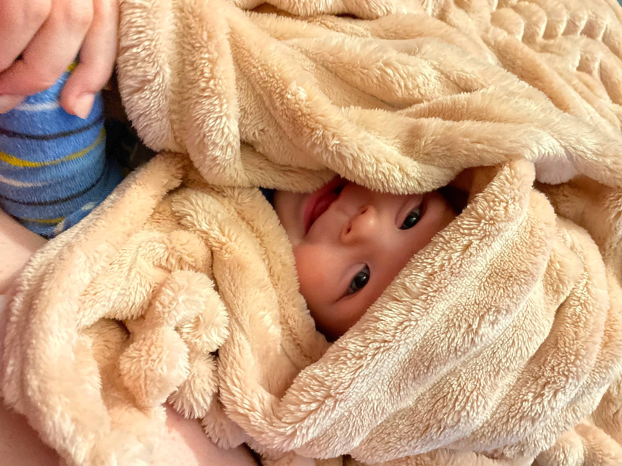 Finnley is registered to the contest to win money with this photo: baby, baby_products, baby_sleeping, baby_toddler_clothing, beige, cheek, comfort, finger, fur, gesture, hand, headgear, headwear, linens, nail, person, skin, sleeve, thumb, toddler
