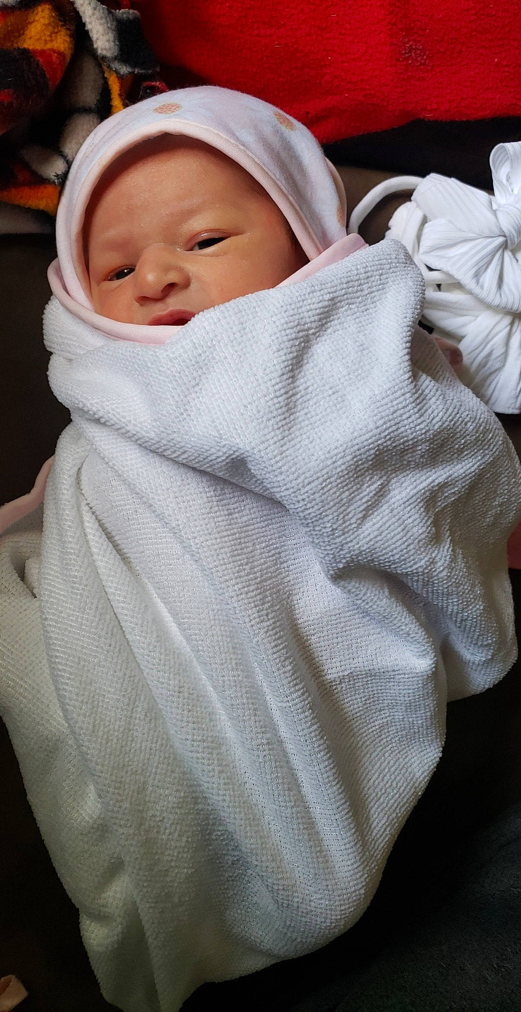 Kenzley is registered to the contest to win money with this photo: baby, baby_products, baby_safety, baby_sleeping, baby_toddler_clothing, bedding, blanket, cap, cheek, child, collar, comfort, hat, linens, person, room, skin, sleeve, textile, toddler