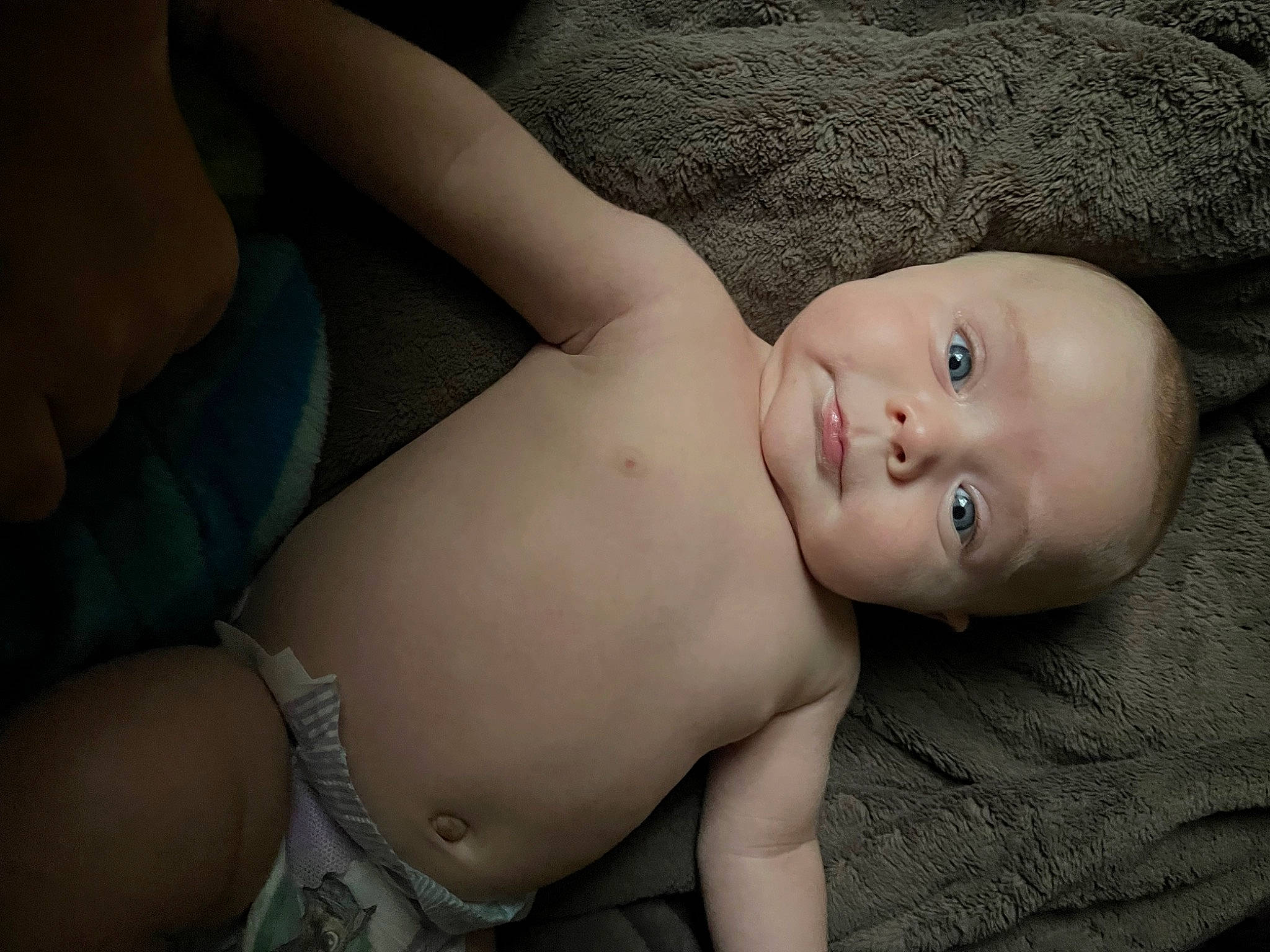 Flynn joined the competition — help win amazing prizes! abdomen, baby, barechested, blond, cheek, chest, comfort, elbow, face, flash_photography, human_body, human_leg, muscle, neck, person, sitting, skin, stomach, thigh, toddler
