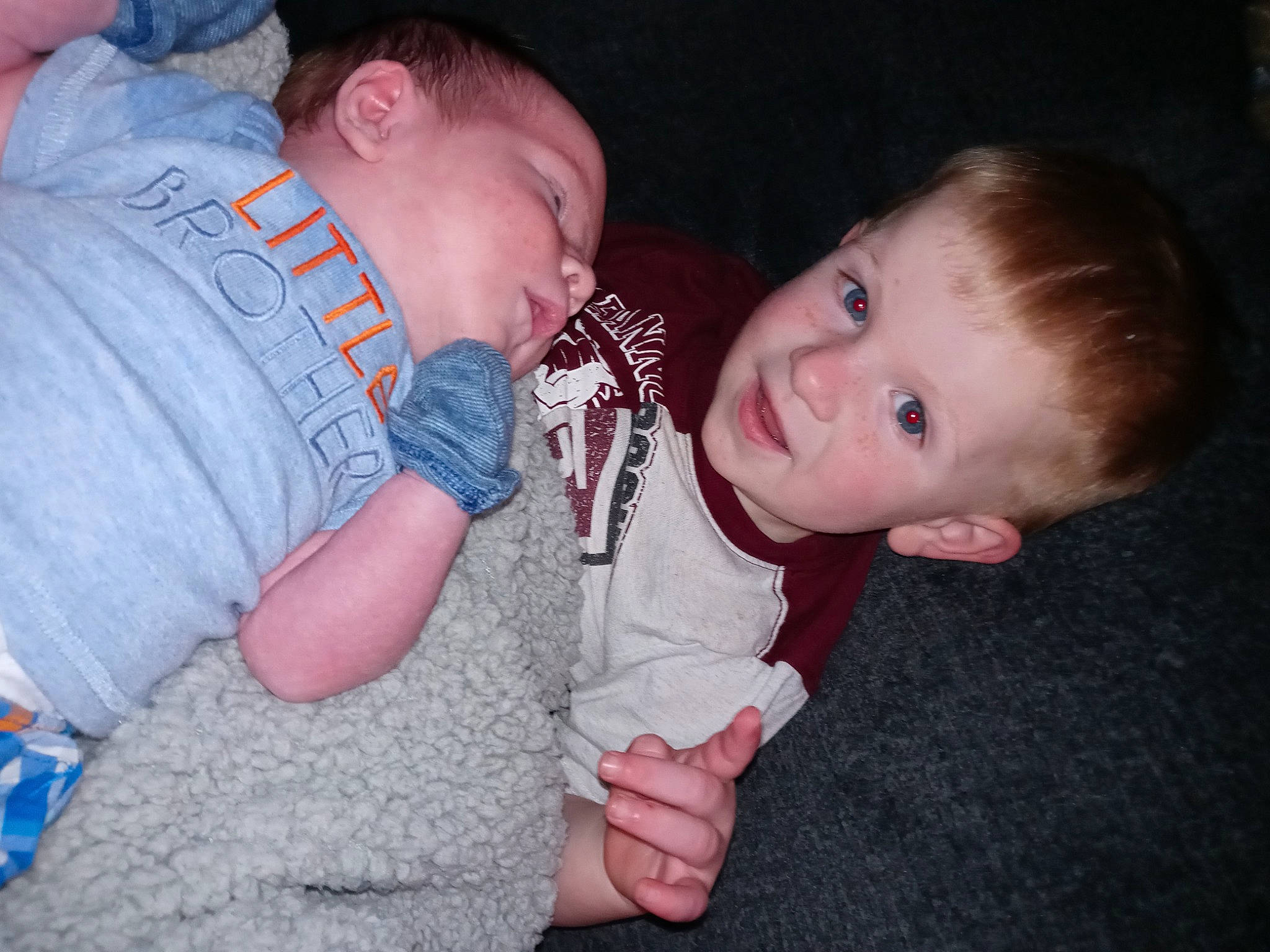 Dagan is registered to the contest to win money with this photo: baby, baby_toddler_clothing, cheek, child, comfort, ear, flash_photography, fun, gesture, happy, iris, leg, mouth, nose, organ, person, sitting, skin, sleeve, thumb