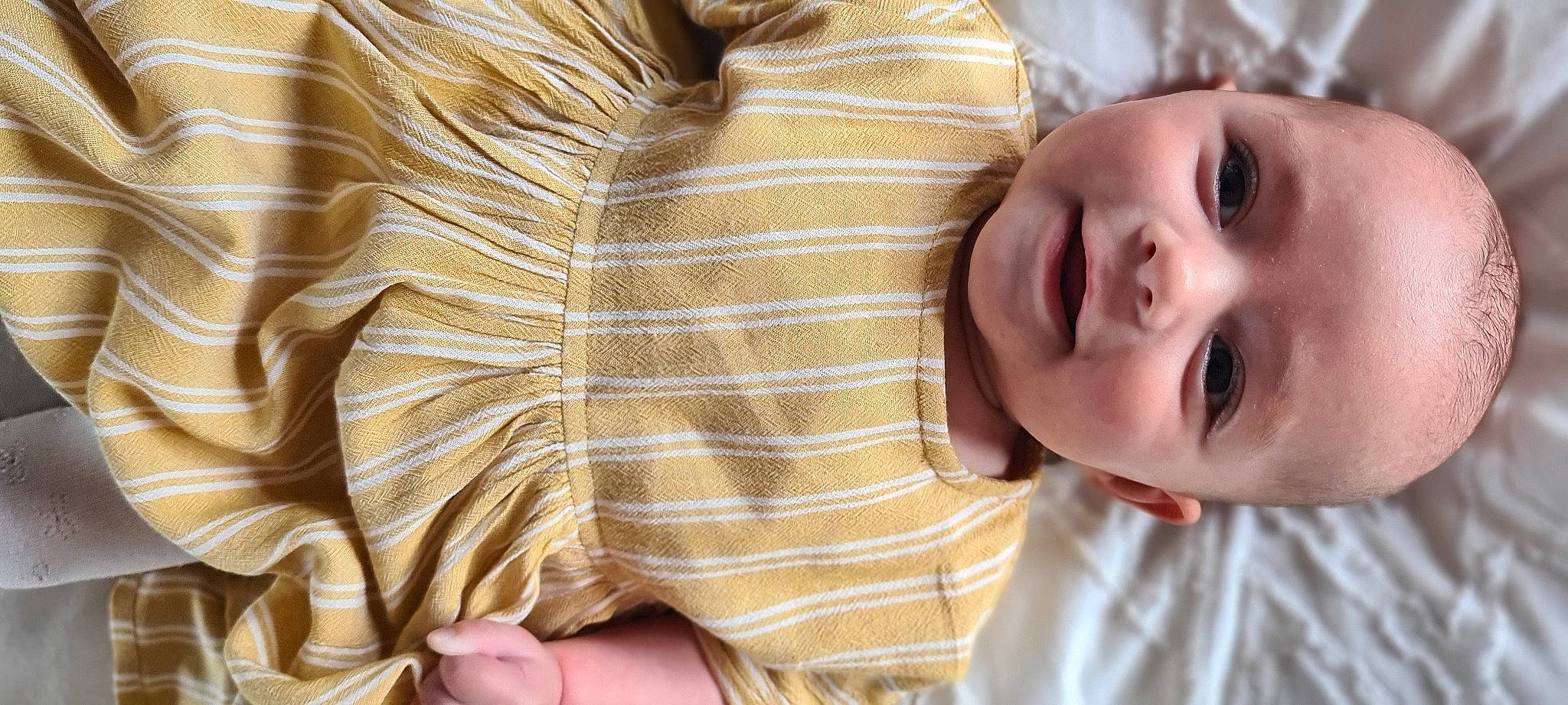 Aura joined the competition — help win amazing prizes! baby, blond, cheek, child, ear, face, facial_expression, finger, happy, head, mouth, neck, nose, person, skin, smile, toddler, yellow