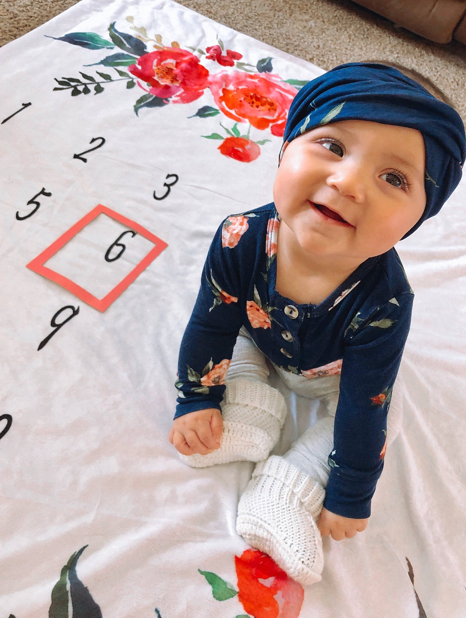 Ellee is registered to the contest to win money with this photo: baby, child, happy, headgear, person, plant, play, recreation, red, smile, t_shirt, textile, toddler